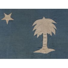 THE EARLIEST SOUTH CAROLINA PALMETTO FLAG IN PRIVATE HANDS, MADE CA 1830-60, WITH BEAUTIFUL COLOR AND A LONE STAR IN PLACE OF A CRESCENT, HANDED DOWN THROUGH THE FAMILY OF GENERAL PHILIP D. COOK (b. 1804, d. 1872) OF THE SOUTH CAROLINA MILITIA, WHO MUSTERED INTO THE HOLCOMB LEGION OF CHARLESTON AND SERVED IN CONFEDERATE CAVALRY COMPANY B (CONGAREE CAVALIERS); FOUND IN A SLIDE-LID WALNUT BOX ACCOMPANIED BY COOK’S MILITIA EPAULETS, RIDING BOOTS, AND COCKADE WITH A CADET BUTTON FROM THE CITADEL