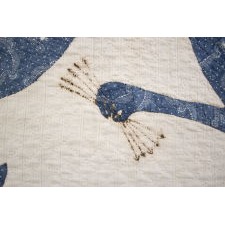 PRE-CIVIL WAR AMERICAN CRIB QUILT WITH A FEDERAL EAGLE, 16 EIGHT-POINTED STARS, AND 16 STRIPES UPON ITS BREAST, BLUE CALICO ON WHITE, CIRCA 1830-1850