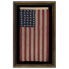 37 STAR ANTIQUE AMERICAN FLAG, ENTIRELY HAND-SEWN AND IN AN ATTRACTIVE, SMALL SCALE FOR THE PERIOD, MADE BY JOSEPH H. FOSTER IN PHILADELPHIA BETWEEN 1867-1876, THE PERIOD WHEN NEBRASKA WAS THE MOST RECENT STATE TO JOIN THE UNION