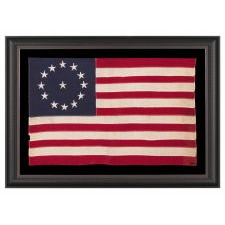 13 STAR ANTIQUE AMERICAN FLAG WITH A CIRCULAR VERSION OF WHAT IS KNOWN AS THE 3RD MARYLAND PATTERN, MADE BETWEEN APPROXIMATELY 1910 AND THE WWII ERA