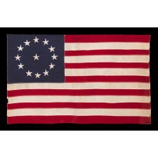 13 STAR ANTIQUE AMERICAN FLAG WITH A CIRCULAR VERSION OF WHAT IS KNOWN AS THE 3RD MARYLAND PATTERN, MADE BETWEEN APPROXIMATELY 1910 AND THE WWII ERA
