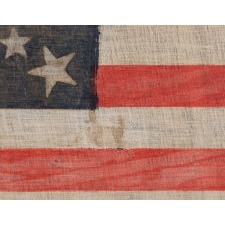 30 STAR FLAG OF THE PRE-CIVIL WAR ERA, A RARE AND BEAUTIFUL ANTIQUE EXAMPLE WITH A DOUBLE-WREATH CONFIGURATION THAT FEATURES A LARGE, HALOED CENTER STAR, WISCONSIN STATEHOOD, 1848-1850
