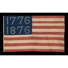 ANTIQUE AMERICAN FLAG WITH 10-POINTED STARS THAT SPELL “1776 – 1876”, MADE FOR THE 100-YEAR ANNIVERSARY OF AMERICAN INDEPENDENCE, ONE OF THE MOST GRAPHIC OF ALL EARLY EXAMPLES: