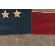44 STARS ON AN ANTIQUE AMERICAN FLAG WITH AN EXAGGERATEDLY TALL AND NARROW CANTON, ON A U.S. ARMY REGULATION BATTLE FLAG MADE DURING THE LATE INDIAN WARS PERIOD, REFLECTS THE RECENT ADDITION OF WYOMING TO THE UNION, 1890-1896