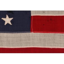 46 STAR ANTIQUE AMERICAN FLAG IN AN EXCEPTIONALLY SMALL SCALE AMONG ITS PIECED-AND-SEWN COUNTERPARTS, REFLECTS OKLAHOMA STATEHOOD, CIRCA 1907-1912: