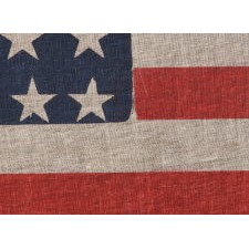 38 STAR ANTIQUE AMERICAN FLAG, MADE DURING THE PERIOD WHEN COLORADO WAS THE MOST RECENT STATE TO JOIN THE UNION, 1876-1889, WITH PENCILED INSCRIPTION FROM THE YOUNG PEOPLE'S SOCIETY OF CHRISTIAN ENDEAVOR (YPSCE), EX-RICHARD PIERCE COLLECTION OF AMERICAN FLAGS, ILLUSTRATED IN HIS BOOK "THE STARS & THE STRIPES"