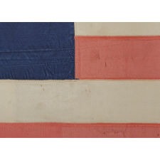 33 GILT-PAINTED STARS IN THREE DIFFERENT SIZES, ARRANGED IN AN INVERTED "GREAT STAR" PATTERN, ON AN ENTIRELY SILK FLAG; AN EXTRAORDINARY EXAMPLE, PROBABLY MADE FOR A STATE MILITIA UNIT, PRE-CIVIL WAR THROUGH WAR PERIOD, 1859-1861, OREGON STATEHOOD