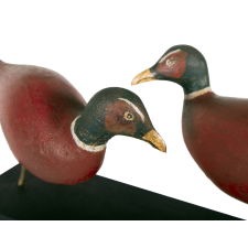 UNUSUAL FOLK CARVING OF TWO RED PHEASANTS FACING OFF, CIRCA 1890-1920