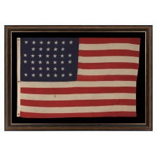 38 STARS IN A NOTCHED, CROSSHATCH PATTERN ON AN ANTIQUE AMERICAN FLAG MADE BY THE U.S. BUNTING COMPANY IN LOWELL, MASSACHUSETTS, 1876-1889, COLORADO STATEHOOD; EX-WHITNEY SMITH COLLECTION (THE MAN WHO COINED THE TERM VEXILLOLOGY)