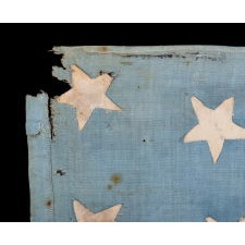 WWII LIBERATION FLAG WITH 48 HASTILY SEWN STARS ON A BEAUTIFUL, CORNFLOWER BLUE CANTON, FOUND BEHIND A CABINET IN A PARIS BASEMENT, MADE TO WELCOME U.S. TROOPS IN FRANCE FOLLOWING LIBERATION FROM THE GERMANS IN 1944, A WONDERFUL EXAMPLE WITH ENDEARING WEAR