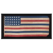 28 STAR ANTIQUE AMERICAN FLAG, REFLECTS THE ADDITION OF TEXAS TO THE UNION AS THE 28TH STATE IN 1845, ONE OF THE RAREST STAR COUNTS IN AMERICAN HISTORY, WITH THE EXCEPTIONALLY UNUSUAL PRESENCE OF RED, WHITE, AND BLUE STRIPES, ALMOST NEVER ENCOUNTERED ON SURVIVING EXAMPLES; OFFICIAL FOR JUST ONE YEAR (1845-46)