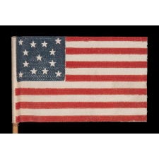 13 STARS IN A MEDALLION PATTERN ON AN ANTIQUE AMERICAN PARADE FLAG MADE BETWEEN APPROXIMATELY 1910 AND THE 1926 SESQUECENTENNIAL OF AMERICAN INDEPENDENCE