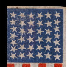 38 STAR ANTIQUE AMERICAN FLAG, WITH SCATTERED STAR POSITIONING, MADE DURING THE PERIOD WHEN COLORADO WAS THE MOST RECENT STATE TO JOIN THE UNION, 1876-1889