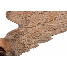 CARVED WOODEN EAGLE OF THE EARLY 19TH CENTURY, WITH EXUBERANT, THREE-DIMENSIONAL FORM AND A NEARLY 6-FOOT WINGSPAN, PERCHED ON A ROCKY OUTCROP