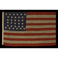 32 STARS, COMMEMORATING MINNESOTA STATEHOOD, CA 1892 – 1926, A VERY RARE FLAG, IN A SMALL SIZE, WITH AN HOURGLASS OR "GLOBAL ROWS" CONFIGURATION