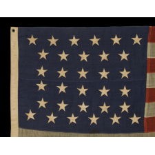 32 STARS, COMMEMORATING MINNESOTA STATEHOOD, CA 1892 – 1926, A VERY RARE FLAG, IN A SMALL SIZE, WITH AN HOURGLASS OR "GLOBAL ROWS" CONFIGURATION