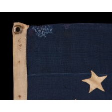 35 STAR ANTIQUE AMERICAN FLAG OF THE CIVIL WAR PERIOD, IN A DESIRABLE SMALL SCALE AMONG ITS COUNTERPARTS, WITH A RARE AND BEAUTIFUL "SNOWBALL MEDALLION"; LIKELY MADE IN BALTIMORE BY SAILMAKER JABEZ LOANE; REFLECTS THE TIME WHEN WEST VIRGINIA WAS THE MOST RECENT STATE TO JOIN THE UNION, 1863-1865