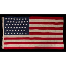 47 STAR ANTIQUE AMERICAN FLAG WITH ZIGZAGGING ROWS, AN EXTREMELY SCARCE EXAMPLE, IN AN UNUSUALLY MANAGEABLE SIZE AMONG ITS KNOWN COUTERPARTS; AN UNOFFICIAL STAR COUNT, 1912, NEW MEXICO STATEHOOD