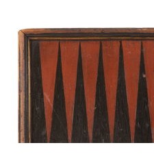 BACKGAMMON BOARD WITH GENEROUS DEPTH, A MOLDED EDGE, EXCEPTIONAL PAINT SURFACE, AND EXAGGERATEDLY STEEP PIPS THAT RESEMBLE ICICLES OR JAGGED TEETH. CIRCA 1840-1850