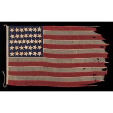 ENTIRELY HAND-SEWN, CIVIL WAR ERA, ANTIQUE AMERICAN FLAG OF THE CIVIL WAR ERA, WITH HAND-SEWN STARS, ENDEARING WEAR FROM LONG-TERM USE, AND ABSOLUTELY BEAUTIFUL PRESENTATION, REFLECTS NEVADA STATEHOOD, 1864-1867