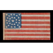 28 STAR ANTIQUE AMERICAN FLAG, THE ONLY KNOWN EXAMPLE OF AN ANTIQUE, PRINTED PARADE FLAG IN THIS STAR COUNT IN ANY FORM; REFLECTS THE ADDITION OF TEXAS TO THE UNION AS THE 28TH STATE IN 1845; PROBABLY MADE TO GLORIFY TEXAS ON A PATRIOTIC OCCASION SOMETIME AFTERWARD, LIKELY AT THE 1876 CENTENNIAL OF OUR NATION’S INDEPENDENCE