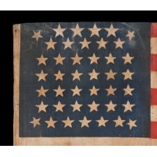 42 STAR ANTIQUE AMERICAN PARADE FLAG WITH AN EXTRAORDINARILY RARE BEEHIVE CONFIGURATION, NEVER AN OFFICIAL STAR COUNT, WASHINGTON STATEHOOD, 1889-1890