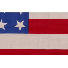 37 STAR ANTIQUE AMERICAN FLAG WITH LINEAL ROWS OF "DANCING" OR "TUMBLING" STARS, NEBRASKA STATEHOOD, 1867-1876, THE ERA OF AMERICAN RECONSTRUCTION