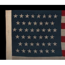 44 STARS IN ZIGZAGGING ROWS ON A PRESS-DYED WOOL AMERICAN FLAG MADE BY THE HORSTMANN COMPANY IN PHILADELPHIA, POSSIBLY FOR USE AS A MILITARY CAMP COLORS, 1890-1896, REFLECTS WYOMING STATEHOOD