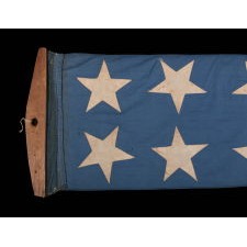 ENTIRELY HAND-SEWN, 32-FOOT, SHIP’S COMMISSION PENNANT OF THE 1845-1865 ERA, A HOMEMADE, COTTON EXAMPLE, WITH 13 STARS ON A CORNFLOWER BLUE CANTON, IN A BEAUTIFUL STATE OF PRESERVATION