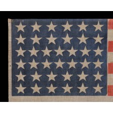 38 STAR ANTIQUE AMERICAN PARADE FLAG, IN AN ESPECIALLY LARGE SCALE AND WITH BOLD COLOR, MADE DURING THE PERIOD WHEN COLORADO WAS THE MOST RECENT STATE ADDED TO THE UNION, 1876-1889