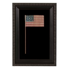 13 STAR ANTIQUE AMERICAN FLAG WITH A MEDALLION CONFIGURATION OF STARS, MADE FOR THE 1876 CENTENNIAL CELEBRATION