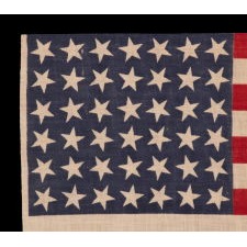 42 STAR ANTIQUE AMERICAN FLAG WITH SCATTERED STAR POSITIONING, AN UNOFFICIAL STAR COUNT, 1889-1890, WASHINGTON STATEHOOD