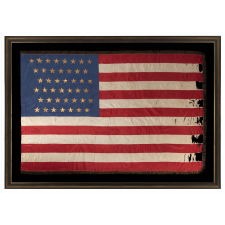 43 GILT-PAINTED STARS ON A SILK, ANTIQUE AMERICAN FLAG WITH BULLION FRINGE; REFLECTS THE ADDITION OF IDAHO AS THE 43RD STATE ON JULY 3RD, 1890, ONE OF THE RAREST STAR COUNTS AMONG SURVIVING AMERICAN FLAGS OF THE 19TH CENTURY