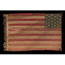 27 STARS AND 15 STRIPES ON A HOMEMADE FLAG WITH ITS CANTON RESTING ON THE WAR STRIPE AND WITH A HIGHLY UNUSUAL FRINGE AND TASSEL; AN EXTREMELY RARE STAR COUNT, MADE DURING THE CIVIL WAR, BOTH TO COMMEMORATE FLORIDA AS THE 27TH STATE AND ILLUSTRATE ITS UNITY WITH THE SOUTH