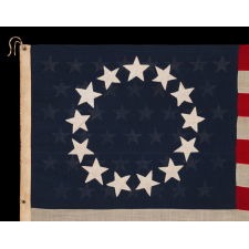 13 STARS IN THE BETSY ROSS PATTERN, WITH 45 STARS ON THE REVERSE; ON AN ANTIQUE AMERICAN FLAG MADE AND SIGNED BY A PREVIOUSLY UNIDENTIFIED FLAG-MAKER, ANNIE MAC LACHLAN OF JERSEY CITY, NEW JERSEY, circa 1896-1908; A RARE AND INTERESTING EXAMPLE, IN A LARGE SCALE AMONG EARLY 13 STAR FLAGS IN THIS DESIGN