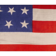 38 STAR ANTIQUE AMERICAN PARADE FLAG WITH SCATTERED STAR ORIENTATION, MADE OF SILK, WITH GENEROUS SCALE AND VIVID COLORS, COLORADO STATEHOOD, 1876-1889