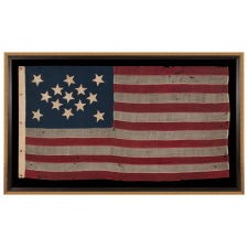 13 STAR FLAG OF THE CIVIL WAR PERIOD, WITH A DIAMOND SHAPED CONFIGURATION OF STARS; ONE OF JUST TWO EARLY EXAMPLES OF THE STARS & STRIPES, WITH SEWN CONSTRUCTION, TO SHARE A VARIANT OF THIS EXTREMELY RARE DESIGN, circa 1863-1865