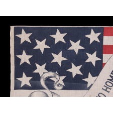 13 STAR AMERICAN PARADE FLAG IN AN EXTREMELY RARE DESIGN, WITH “PROTECTION TO HOME INDUSTRIES” SLOGAN ON A FANCIFUL, SCROLLING STREAMER, MADE FOR THE 1888 PRESIDENTIAL CAMPAIGN OF BENJAMIN HARRISON; FORMERLY IN THE COLLECTION OF RICHARD PIERCE
