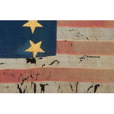 EXCEPTIONAL, HAND-SEWN, SILK FLAG WITH 13 GILT-PAINTED STARS ARRANGED IN THE "TRUMBULL” PATTERN, ONE OF JUST A TINY HANDFUL OF EARLY EXAMPLES TO SURVIVE IN THIS CONFIGURATION, FOUND IN SWITZERLAND, IN THE ESTATE OF A SWISS-AMERICAN WHO FOUGHT IN THE AMERICAN CIVIL WAR; THIS FLAG MADE IN THE LATE FEDERAL –ANTEBELLUM PERIOD, circa 1824-1851