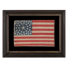 42 STARS IN A MEDALLION CONFIGURATION. WITH A LARGE, HALOED CENTER STAR AND A TRIO OF 3 STARS IN EACH CORNER, ON AN EXCEPTIONALLY RARE ANTIQUE AMERICAN PARADE FLAG, WASHINGTON STATEHOOD, circa 1889-1890