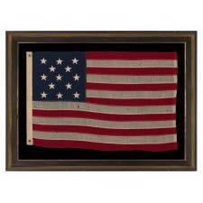 13 STAR ANTIQUE AMERICAN FLAG WITH A 3-2-3-2-3 CONFIGURATION OF STARS; A SMALL-SCALE EXAMPLE OF THE 1895-1926 ERA WITH ESPECIALLY NICE VISUAL QUALITIES