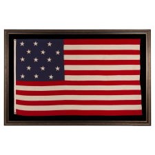 ANTIQUE AMERICAN FLAG WITH 15 STARS & 15 STRIPES, A COPY OF THE STAR SPANGLED BANNER, THE FAMOUS FLAG IN AMERICA, UPON WHICH FRANCIS SCOTT KEY GAZED IN BALTIMORE HARBOR WHILE WRITING THE WORDS TO THE SONG OF THE SAME NAME; REFLECTS THE ADDITION OF KENTUCKY AS THE 15TH STATE IN 1792. THIS FLAG LIKELY MADE BY ANNIN & COMPANY IN NEW YORK CITY TO COMMEMORATE THE CENTENNIAL OF THE WAR OF 1812