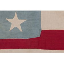 16 STARS AND 11 STRIPES THAT START AND END ON WHITE, ON A HOMEMADE FLAG MADE BETWEEN THE CIVIL WAR (1861-65) AND THE 1876 CENTENNIAL; THESE TWO COUNTS GLORIFY TENNESSEE AS BOTH THE 16TH STATE TO JOIN THE UNION AND THE 11TH TO SECEDE