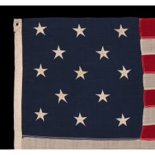 13 STAR ANTIQUE AMERICAN FLAG WITH A 3-2-3-2-3 CONFIGURATION OF STARS; A SMALL-SCALE EXAMPLE, MADE CIRCA 1895-1926