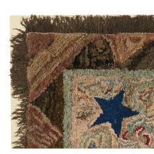 WOOL HOOKED RUG WITH A CANTED, SPREAD-WINGED, FEDERAL EAGLE, ON A MODELED GROUND WITH TWO STARS, A PRAIRIE POINT BORDER, AND A CHENILLE FRINGE, circa 1835 -1865