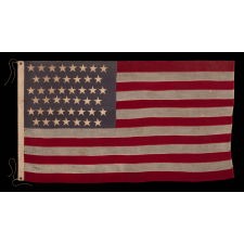 45 STAR ANTIQUE AMERICAN FLAG WITH STAGGERED ROWS OF STARS ON A DUSTY BLUE CANTON; REFLECTS THE PERIOD WHEN UTAH WAS THE MOST RECENT STATE TO JOIN THE UNION, 1890-1896