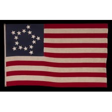 15 STAR ANTIQUE AMERICAN FLAG WITH AN EXTREMELY RARE “CIRCLE-STAR” VERSION OF THE GREAT STAR PATTERN AND A COMPLEMENT OF 13 STRIPES; MADE DURING THE 1ST QUARTER OF THE 20TH CENTURY TO EITHER CELEBRATE KENTUCKY STATEHOOD, OR TO COMMEMORATE THE WAR OF 1812, OR TO REPRESENT THE ERA IN WHICH THERE WERE 15 STATES (1792-1796) OR THE FLAG OFFICIALLY BORE 15 STARS (1795-1818)