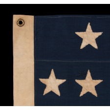 38 HAND-SEWN STARS IN A "NOTCHED" PATTERN, ON AN ANTIQUE AMERICAN FLAG WITH BEAUTIFUL WEAR FROM HAVING BEEN EXTENSIVELY FLOWN, MADE AT THE TIME WHEN COLORADO WAS THE MOST RECENT STATE TO JOIN THE UNION, 1876-1889