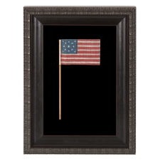 13 STAR ANTIQUE AMERICAN FLAG WITH A MEDALLION CONFIGURATION OF STARS, MADE FOR THE 1876 CENTENNIAL CELEBRATION
