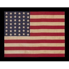 42 STARS IN A WAVE CONFIGURATION OF LINEAL COLUMNS, ON AN ANTIQUE AMERICAN FLAG THAT REFLECTS THE PERIOD OF WASHINGTON STATEHOOD, NEVER AN OFFICIAL STAR COUNT, circa 1889-1890